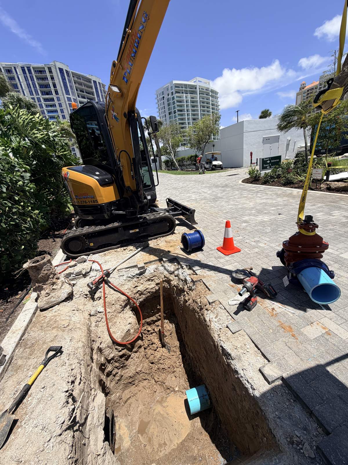Water main and gate valve work beside the County excavator